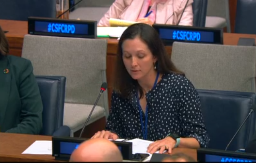 Photo of Emma Phillips speaking at the UN