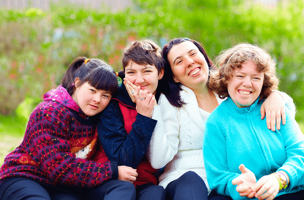 Photo of a group of happy women with disability in a park